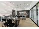 Modern kitchen featuring stainless steel appliances, sleek cabinets, a large island, and bright lighting at 3817 W San Nicholas St, Tampa, FL 33629
