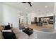 Spacious living room with open floor plan flowing into a modern kitchen, perfect for entertaining and Gathering living at 3817 W San Nicholas St, Tampa, FL 33629