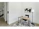 Minimalist office space with neutral tones, simple desk, and a view of the outdoors at 3817 W San Nicholas St, Tampa, FL 33629