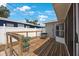 Cozy back deck features a wooden deck, railing and is perfect for relaxing or entertaining outdoors at 4558 23Rd N Ave, St Petersburg, FL 33713