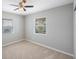 Simple bedroom features carpet flooring, natural light, and a ceiling fan at 4558 23Rd N Ave, St Petersburg, FL 33713