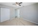 Neutral bedroom with carpet flooring, ceiling fan, closet and a window at 4558 23Rd N Ave, St Petersburg, FL 33713