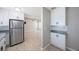 Modern kitchen with white cabinets, stainless steel appliances and tiled flooring at 4558 23Rd N Ave, St Petersburg, FL 33713