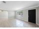 Bright living room with large window offering natural light and tiled flooring throughout at 4558 23Rd N Ave, St Petersburg, FL 33713