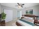 Cozy primary bedroom with a wood accent wall, closet and ensuite bathroom entrance at 4558 23Rd N Ave, St Petersburg, FL 33713