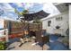 Inviting back patio with comfortable seating under a large umbrella, adjacent to the house at 4601 83Rd N Ave, Pinellas Park, FL 33781