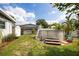 Backyard featuring an above ground pool, shed, palm trees, and wood fence at 4601 83Rd N Ave, Pinellas Park, FL 33781