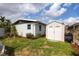 Cozy backyard featuring a storage shed, well-kept lawn, and landscaping offering a functional outdoor space at 4601 83Rd N Ave, Pinellas Park, FL 33781