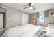 Bedroom features a ceiling fan, window, closet with white doors, and light-colored walls at 4601 83Rd N Ave, Pinellas Park, FL 33781