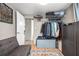 Small bedroom featuring a wire shelf, closet, sofa, and a rug at 4601 83Rd N Ave, Pinellas Park, FL 33781