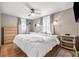 Bright bedroom featuring a ceiling fan, two windows, and neutral walls at 4601 83Rd N Ave, Pinellas Park, FL 33781