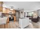 Open kitchen with wood cabinets, stainless appliances, and island that flows into the living area at 4601 83Rd N Ave, Pinellas Park, FL 33781