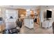 Bright kitchen with wood cabinets, stainless appliances, and a mobile island with a butcher block top at 4601 83Rd N Ave, Pinellas Park, FL 33781
