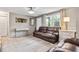 Inviting living room featuring comfortable leather seating, bright windows, and stylish decor at 4601 83Rd N Ave, Pinellas Park, FL 33781
