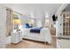 Charming main bedroom with a king bed, white walls, and luxury vinyl plank flooring at 4601 83Rd N Ave, Pinellas Park, FL 33781