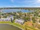 High angle view featuring waterfront community with a lake, docks, and lush greenery, ideal for waterfront living at 4734 Cobia Se Dr # A, St Petersburg, FL 33705