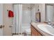 Cozy bathroom featuring shower-tub, toilet, and vanity sink with a poster and towels at 4734 Cobia Se Dr # A, St Petersburg, FL 33705