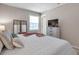 Comfortable bedroom features a bed, dresser, mirror, and a window with natural light at 4734 Cobia Se Dr # A, St Petersburg, FL 33705
