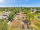 Aerial view of community garden plots surrounded by greenery, ready for planting and outdoor enjoyment at 4734 Cobia Se Dr # A, St Petersburg, FL 33705