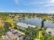 Overhead shot of a yellow two-story condo complex, showcasing its lakeside location and parking facilities at 4734 Cobia Se Dr # A, St Petersburg, FL 33705