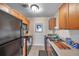 Efficient kitchen layout with practical wooden cabinetry and modern appliances maximizing functionality at 4734 Cobia Se Dr # A, St Petersburg, FL 33705