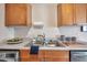 Close-up of the stainless steel kitchen sink with modern fixtures, surrounded by ample counter space and storage at 4734 Cobia Se Dr # A, St Petersburg, FL 33705