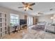 Cozy living area features tile floors, a ceiling fan, and a workstation with a view from the window at 4734 Cobia Se Dr # A, St Petersburg, FL 33705