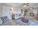 Inviting living room featuring neutral paint, tile floors, ceiling fan, and a comfortable seating arrangement at 4734 Cobia Se Dr # A, St Petersburg, FL 33705