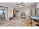 Open living space with tile floors, fan, and a peek into kitchen, creates a welcoming atmosphere at 4734 Cobia Se Dr # A, St Petersburg, FL 33705