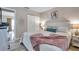 Cozy main bedroom featuring a comfortable queen bed, soft lighting, and practical built-in closet at 4734 Cobia Se Dr # A, St Petersburg, FL 33705