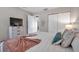 Relaxing main bedroom suite with neutral tones, a comfortable queen-size bed, and ample closet space at 4734 Cobia Se Dr # A, St Petersburg, FL 33705