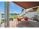 Underneath view of a patio with outdoor table and chairs overlooking water and landscaping at 4734 Cobia Se Dr # A, St Petersburg, FL 33705