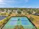 Overhead shot of neighborhood tennis courts offering a recreational space with city skyline views at 4734 Cobia Se Dr # A, St Petersburg, FL 33705