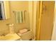 A clean bathroom featuring a shower stall, vanity with sink, and fresh towels neatly arranged on the towel rack at 4922 Genesis Ave, Holiday, FL 34690