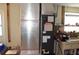 Image shows a Goodman furnace system with foil-wrapped ductwork, positioned next to a workbench and window at 4922 Genesis Ave, Holiday, FL 34690