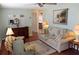 Cozy living room with a classic dresser, a comfortable sofa, and stylish decor at 4922 Genesis Ave, Holiday, FL 34690