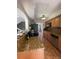 Kitchen features granite countertops, wood cabinets, stainless steel appliances, and tile floors at 4967 Steel Dust Ln, Lutz, FL 33559