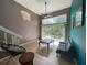 Cozy living room boasts vaulted ceiling, accent wall, with access to a private outdoor patio at 4967 Steel Dust Ln, Lutz, FL 33559