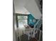 Bright living room with high ceilings, tile floors, and sliding glass doors to the backyard patio at 4967 Steel Dust Ln, Lutz, FL 33559