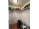Unorganized walk-in closet with wire shelving and visible clutter at 4967 Steel Dust Ln, Lutz, FL 33559