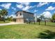 The property has a spacious backyard with a fence and a view of the surrounding landscape at 5144 Cedarbrook Ln, Hernando Beach, FL 34607