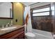 Bathroom featuring granite countertops, decorative tiling, and a shower-tub combination at 5144 Cedarbrook Ln, Hernando Beach, FL 34607