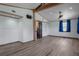Spacious bedroom with wood floors, exposed beam, and neutral walls at 5144 Cedarbrook Ln, Hernando Beach, FL 34607
