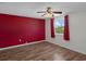 Bright bedroom with a bold accent wall and natural light at 5144 Cedarbrook Ln, Hernando Beach, FL 34607