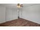 Bright bedroom with a ceiling fan and a spacious closet at 5144 Cedarbrook Ln, Hernando Beach, FL 34607