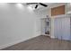 Bedroom with tall ceilings and modern touches; ensuite bath visible through doorway at 5144 Cedarbrook Ln, Hernando Beach, FL 34607