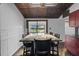 Dining room boasts decorative ceilings, granite table top, with a sliding glass door to the backyard at 5144 Cedarbrook Ln, Hernando Beach, FL 34607