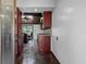 Open kitchen with granite counters and an island at 5144 Cedarbrook Ln, Hernando Beach, FL 34607