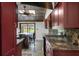 Kitchen features granite countertops, stainless steel appliances, and an island with seating at 5144 Cedarbrook Ln, Hernando Beach, FL 34607