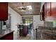 View of the kitchen featuring a stainless steel refrigerator, granite countertops, and island seating at 5144 Cedarbrook Ln, Hernando Beach, FL 34607